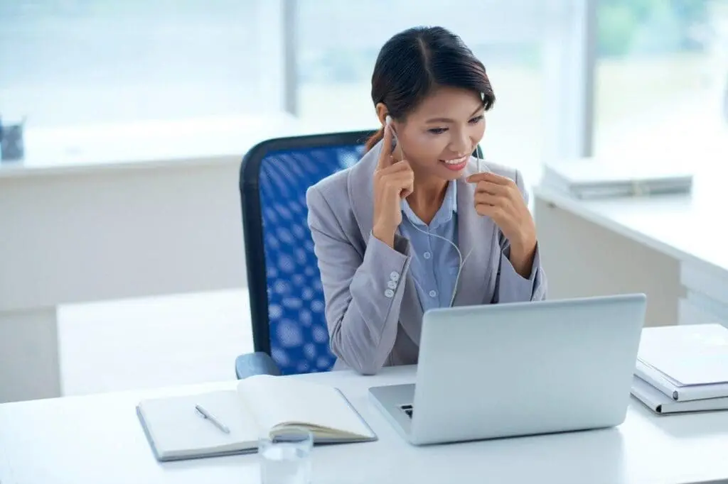 Women talking on laptop