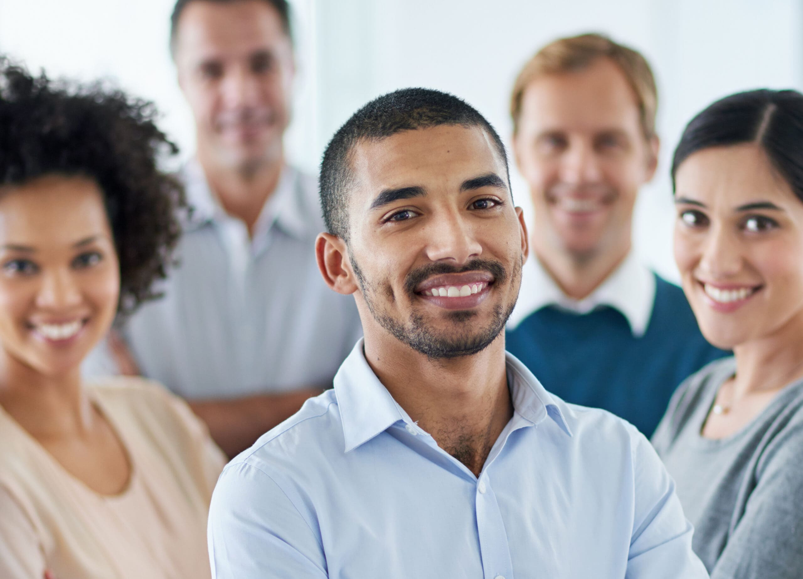 Striving for success. Portrait of a group of diverse colleagues standing in an office