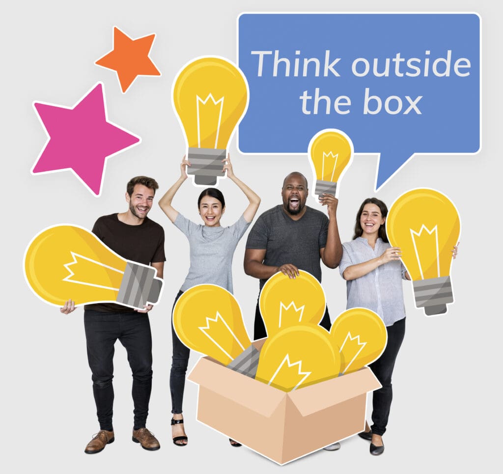 Team holding light bulbs with 'Think outside the box' concept